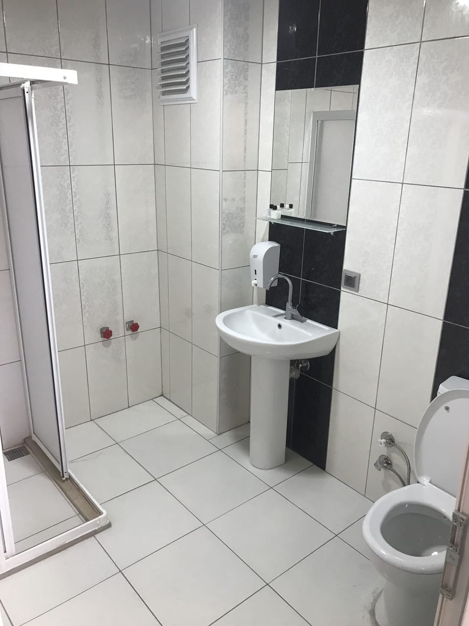 Shower, bathrobes, slippers, towels