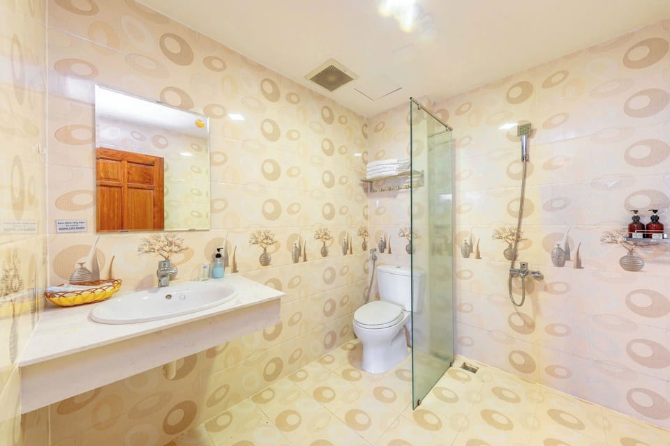 Shower, free toiletries, hair dryer, slippers