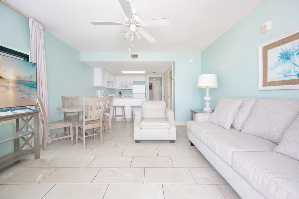 Unwind in the airy living space with comfortable seating and a dining area, perfect for enjoying meals together