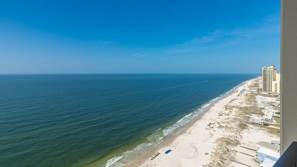 Watch the coastline stretch into the distance and the horizon meet the sky from your balcony while you soak up the sun