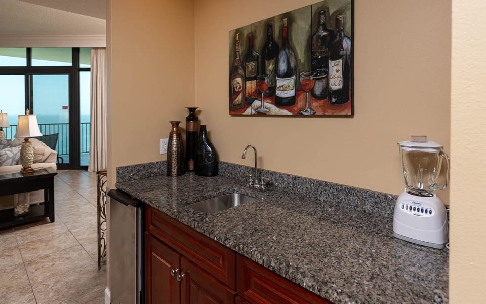 Mix refreshing drinks at your wet bar, surrounded by inviting decor and the lively vibe of your coastal retreat