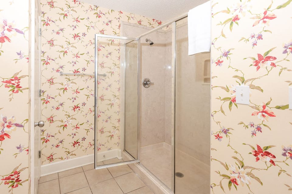 Indulge in relaxation in the master bath with a refreshing walk-in shower and soothing jetted tub