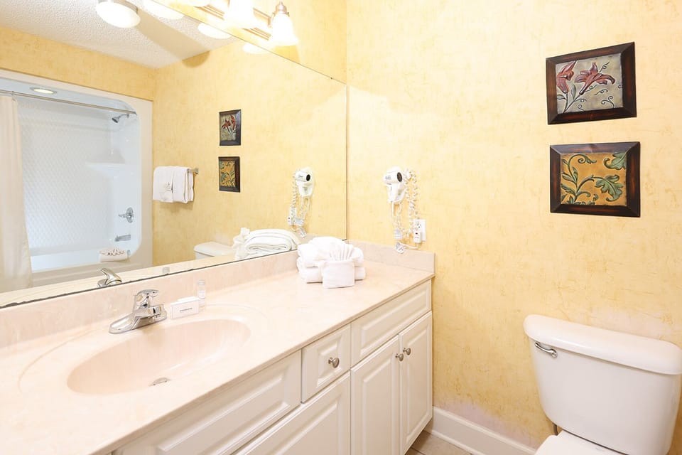 Pamper yourself in this guest bath for morning routines and get ready for fun beach adventures