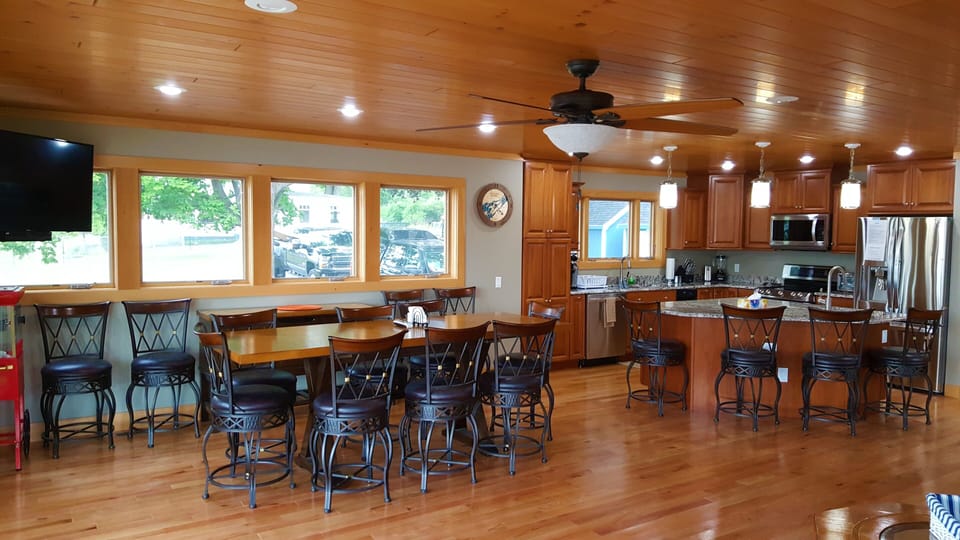 Open-concept and 16ft floor-to-ceiling glass doors for uninterrupted river views