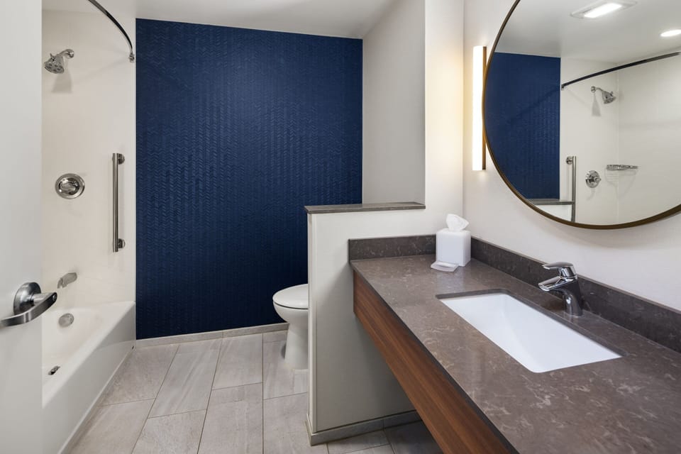 Designer toiletries, hair dryer, towels, soap
