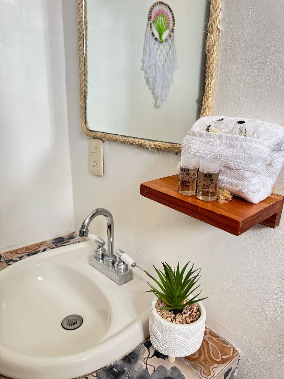 Rainfall showerhead, towels, soap, shampoo