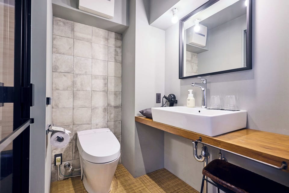 Junior Suite, Non Smoking | Bathroom | Separate tub and shower, deep soaking tub, hair dryer, slippers
