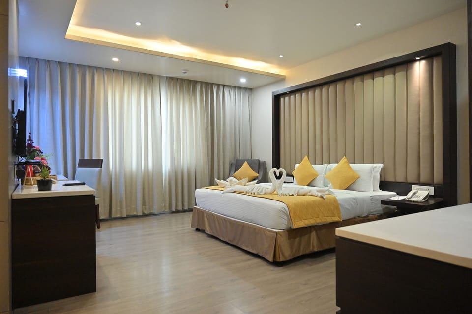 Grand Suite, Bathtub, City View | Minibar, in-room safe, desk, iron/ironing board