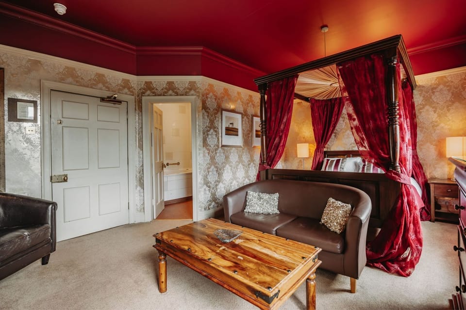 Deluxe Four Poster Room, King Bed | Minibar, in-room safe, individually decorated, individually furnished