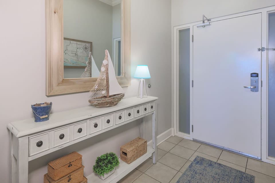 Step into this inviting entryway, where coastal decor welcomes you home from beach adventures