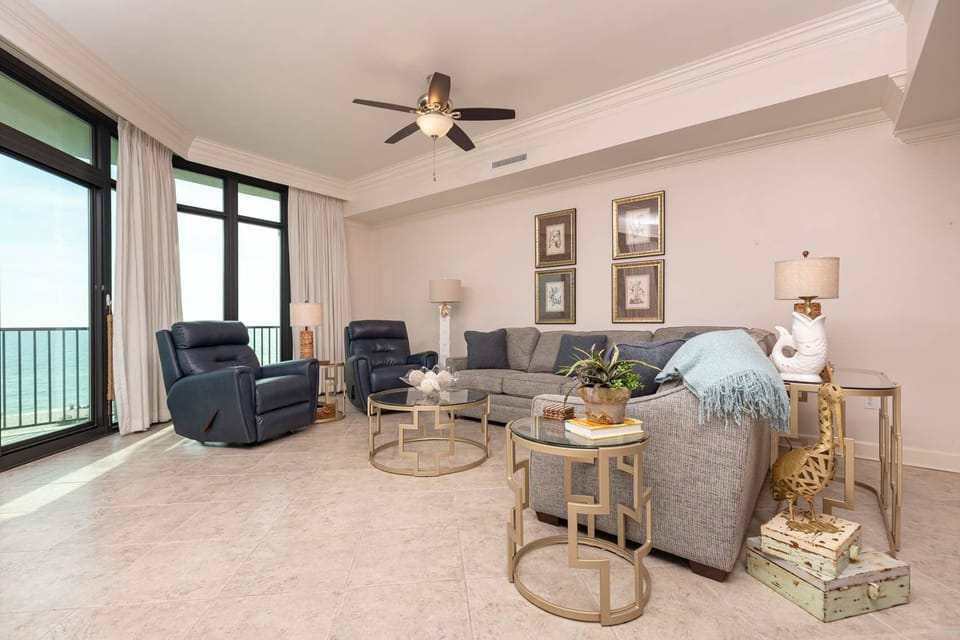 Relax and unwind in the living room with a cozy sofa with a queen sleeper while taking in stunning views of the beach