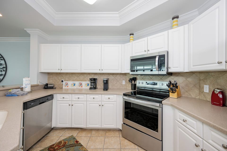 Craft delicious meals with ease in this inviting kitchen, enhanced by stylish appliances and ample counter space