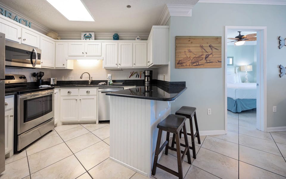 Prepare meals in this stylish, featuring stainless appliances and a welcoming atmosphere