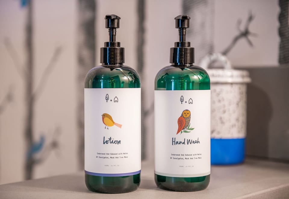 Designer toiletries, hair dryer, bathrobes, towels