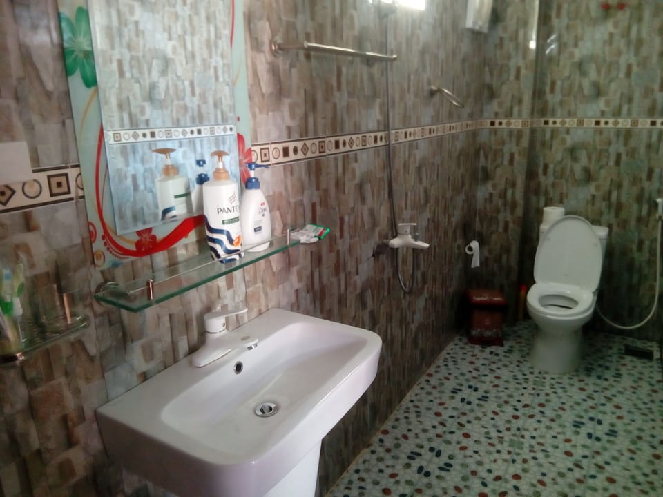 Shower, free toiletries, hair dryer, slippers