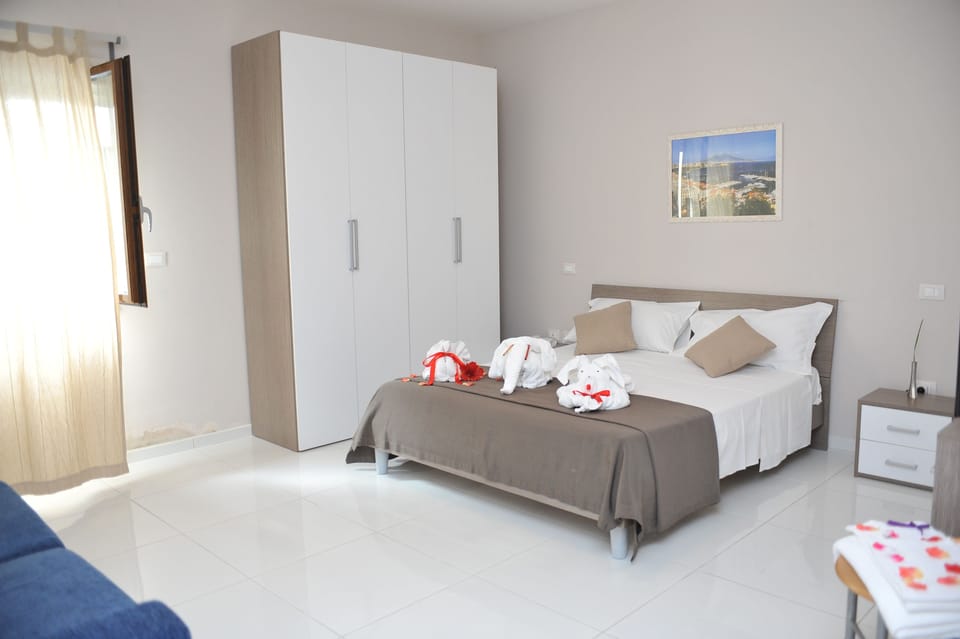 Triple Room | Minibar, desk, iron/ironing board, free WiFi
