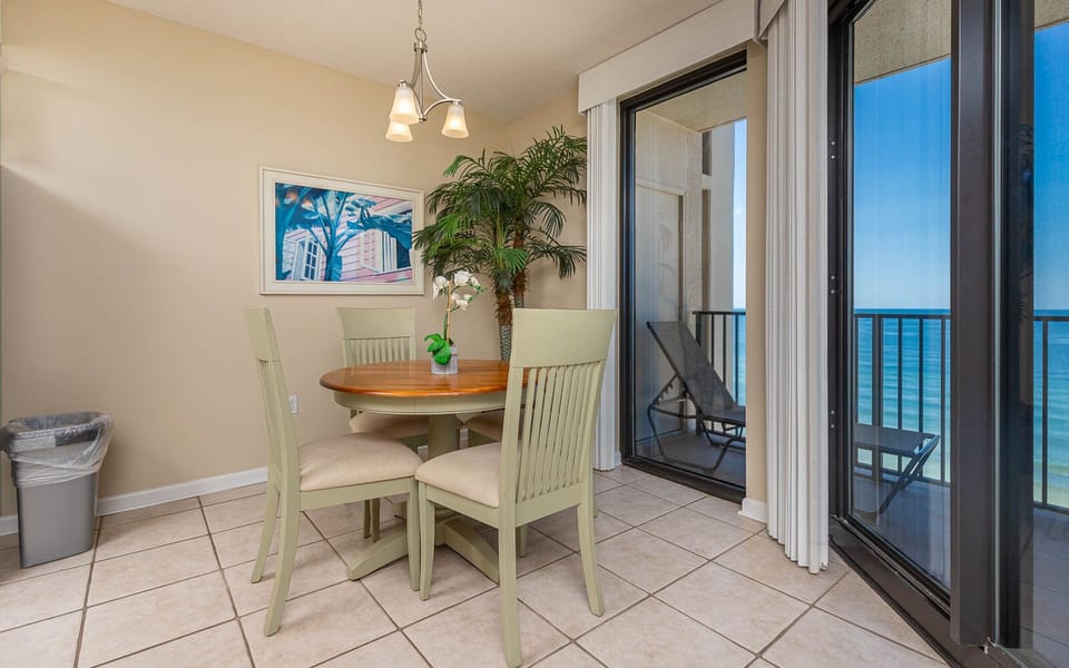 Enjoy meals at the round dining table with views through sliding glass doors that lead to a relaxing outdoor space