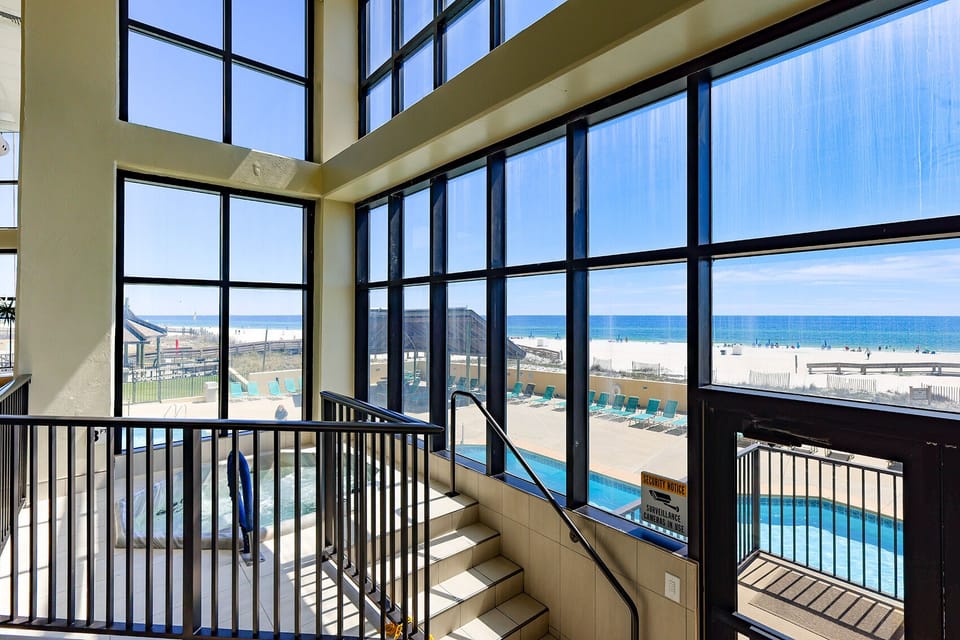 Gaze at the stunning beachfront views from inside Phoenix I, complete with a pool and relaxing hot tub for your perfect getaway