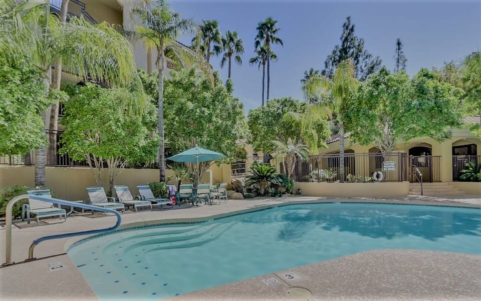 Fabulous resort like pool and spa (hot tub) area with ample umbrellas and shade 
