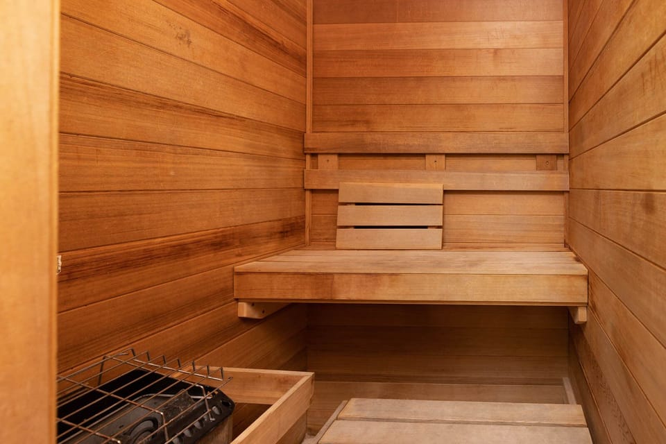 Relax in the warm, wooden sauna, perfect for unwinding after a day at the beach