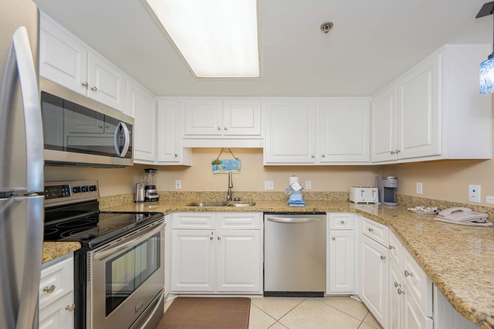 Cool tile warms your feet while you prepare fresh gulf coast snacks in the bright kitchen space