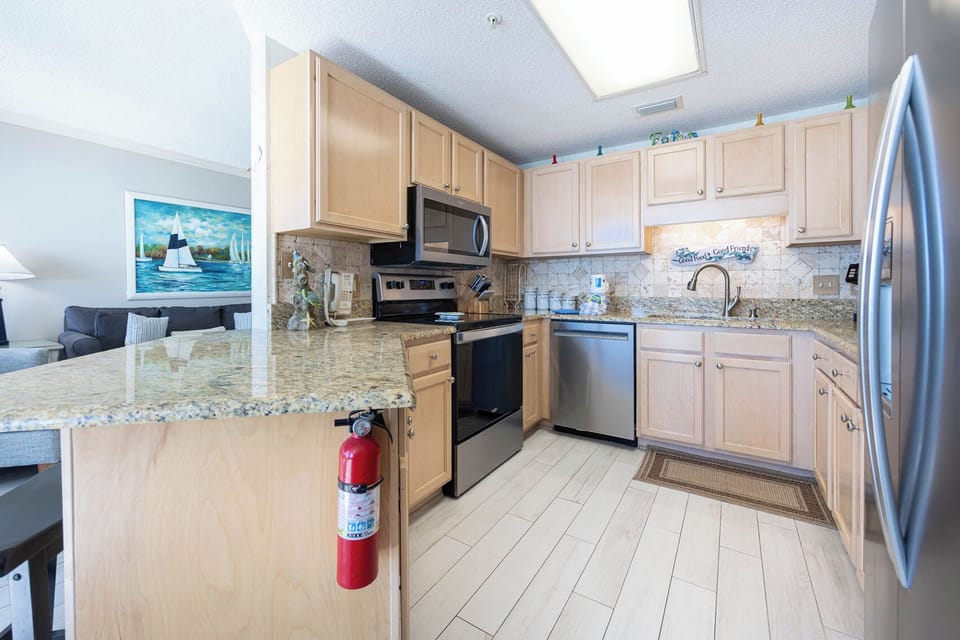 Cook and gather in this inviting kitchen, featuring granite counters and stainless appliances for your culinary adventures