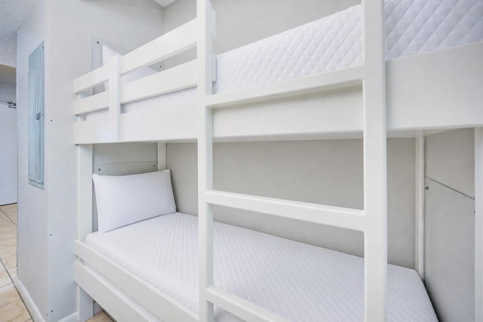 Cozy bunk bed area, perfect for kids, with easy access to the hallway and nearby living space