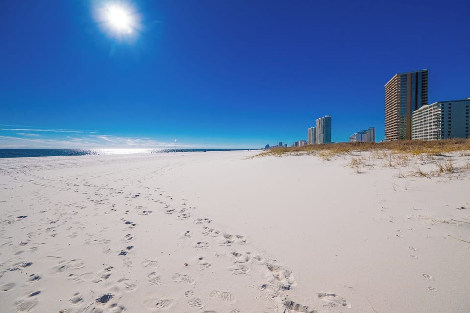 Experience stunning views of the pristine beach and vibrant shoreline from your vacation rental at Phoenix VII