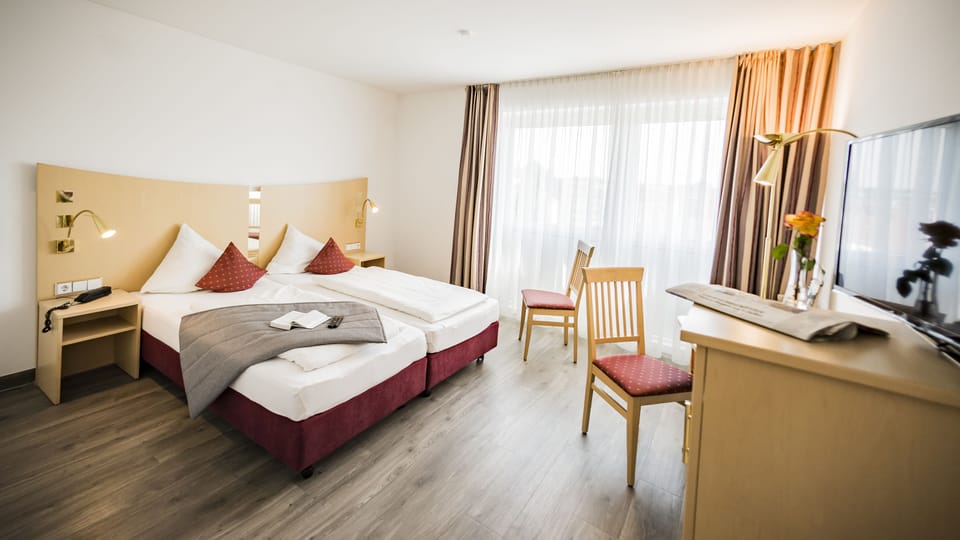 Standard Double or Twin Room | Living room | Flat-screen TV