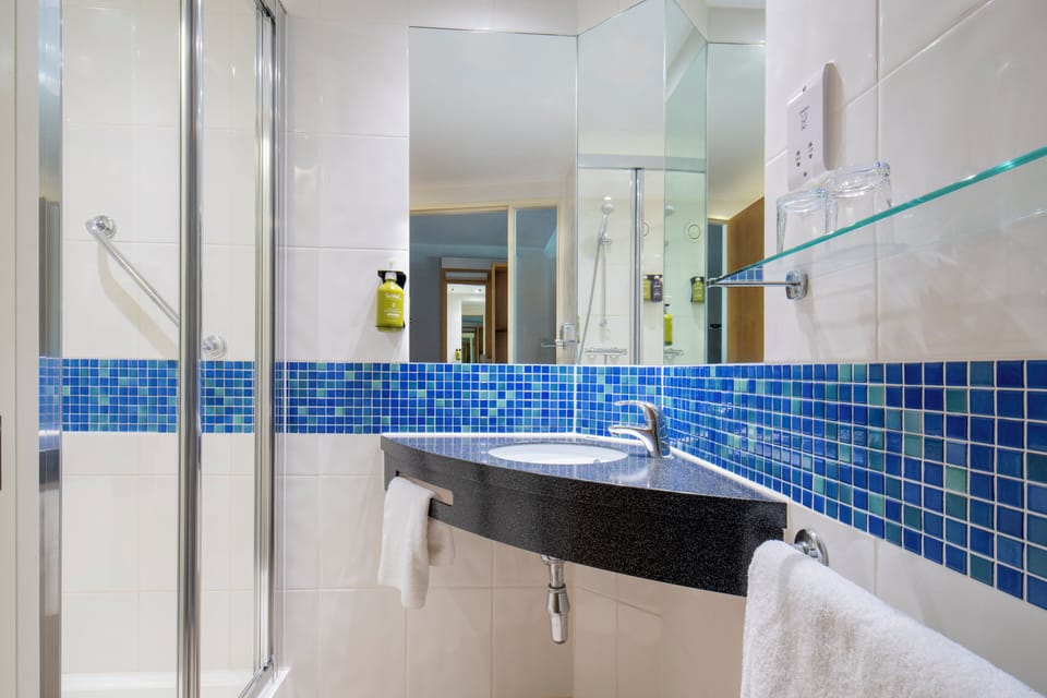 Shower, eco-friendly toiletries, hair dryer, towels