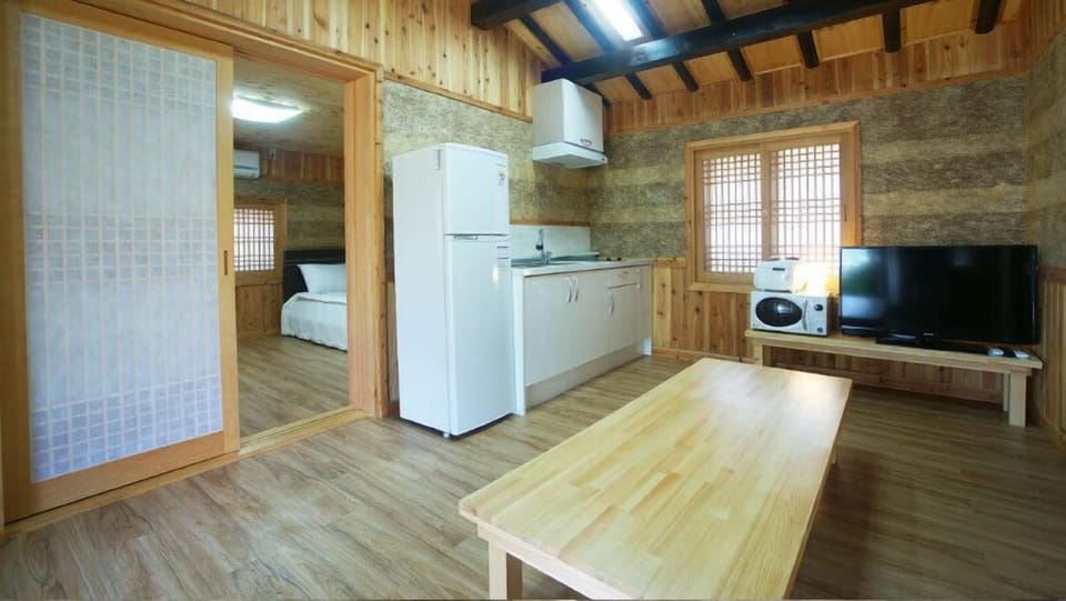 Traditional Double Room (20 PY) | Living area | 42-inch flat-screen TV with cable channels, TV