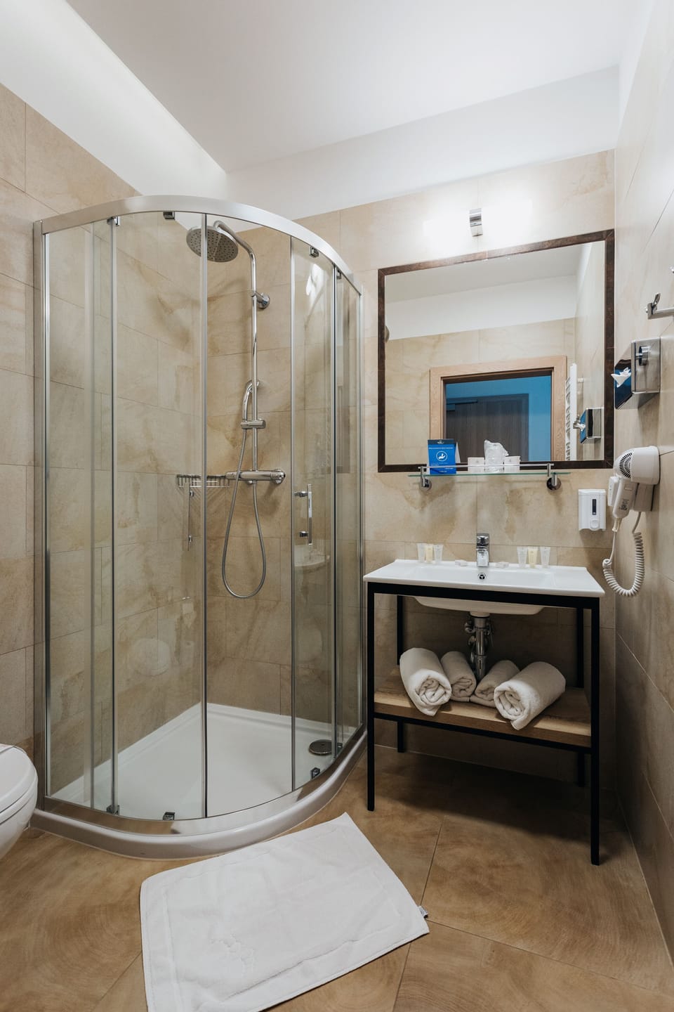 Shower, free toiletries, hair dryer, towels
