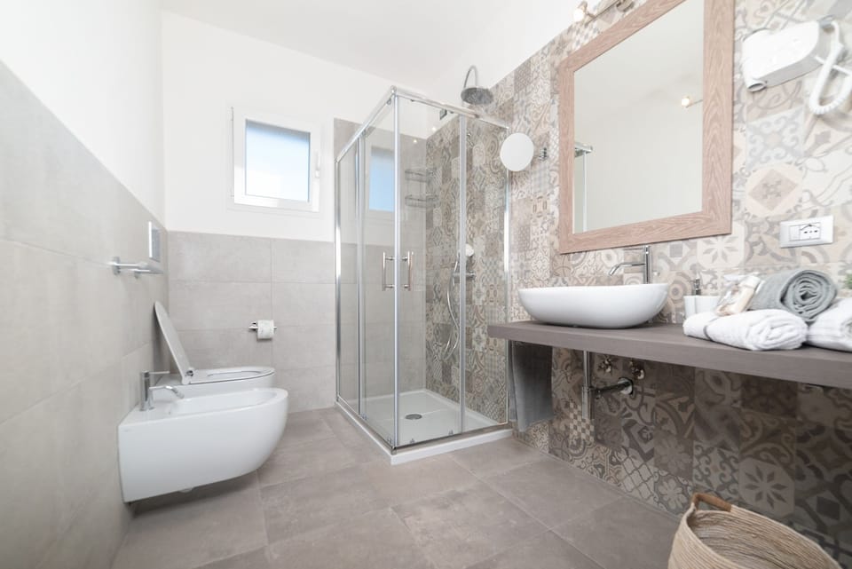 Shower, eco-friendly toiletries, hair dryer, bidet