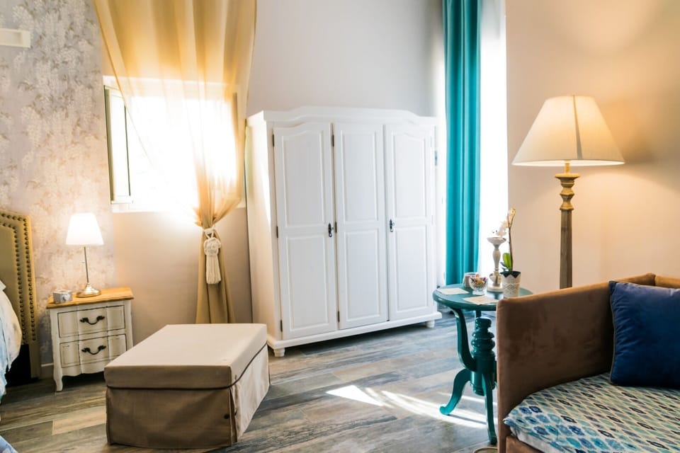 Panoramic Quadruple Room, Terrace, Pool View | Minibar, in-room safe, desk, soundproofing