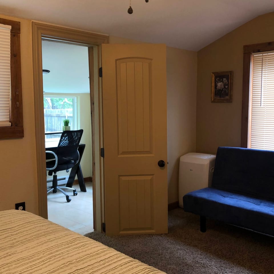 Upper bedroom with sunroom/workspace 