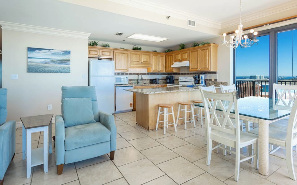 Unwind in the airy living space with comfortable seating and a dining area that invites meals with a beachfront view