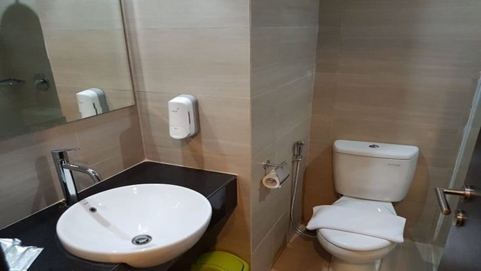 Shower, free toiletries, slippers, towels
