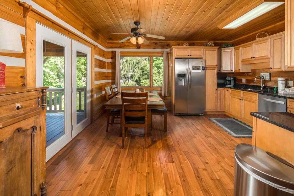Open kitchen and dining area with easy access to the deck and outdoor seating