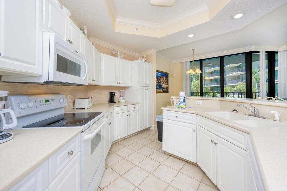 Create delightful meals in this kitchen while enjoying the inviting view from the balcony
