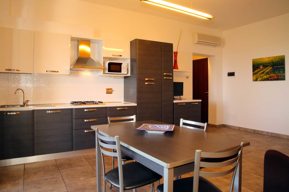Family Apartment, 1 Bedroom, Terrace, Sea View | In-room dining