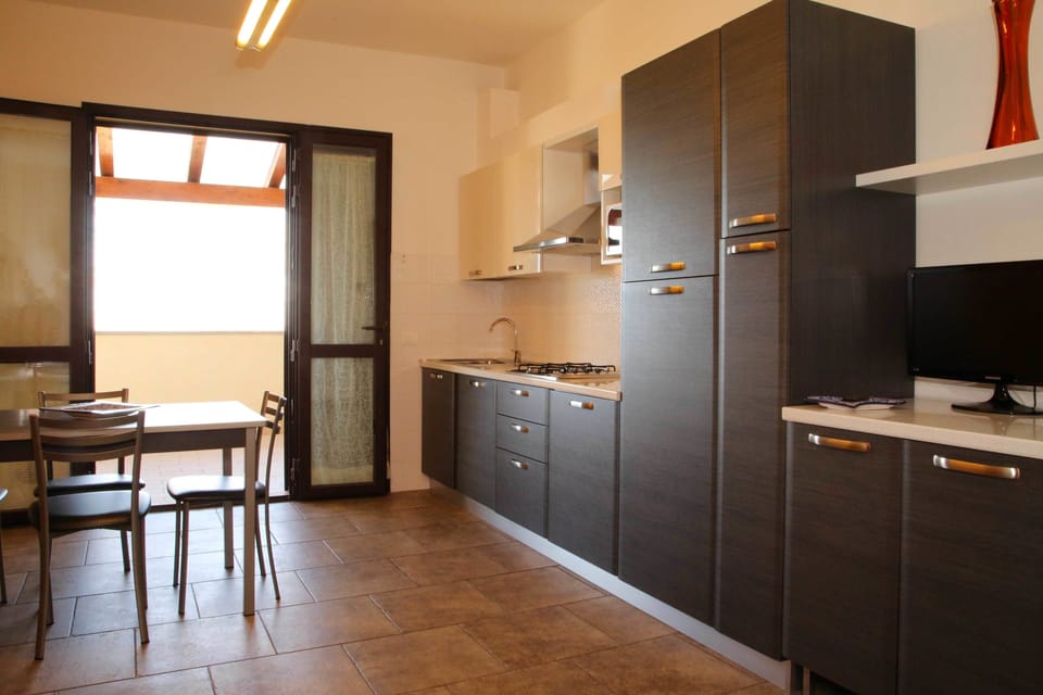 Family Apartment, 1 Bedroom, Terrace, Sea View | Private kitchen | Full-size fridge, stovetop, dishwasher, cookware/dishes/utensils