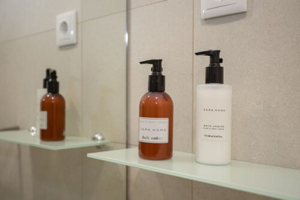 Shower, hair dryer, slippers, towels