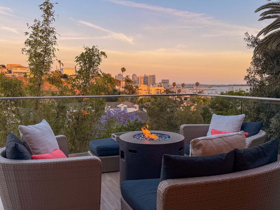 Take in sweeping canyon, harbor, and city views from the deck, a breathtaking backdrop that feels both elevated and serene.