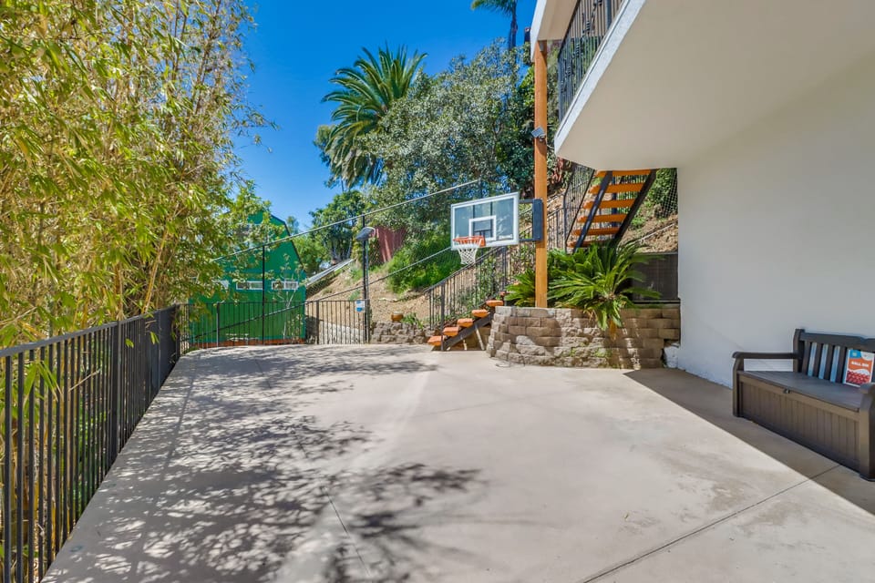 Zen inspired private basketball court surrounded by lush greenery