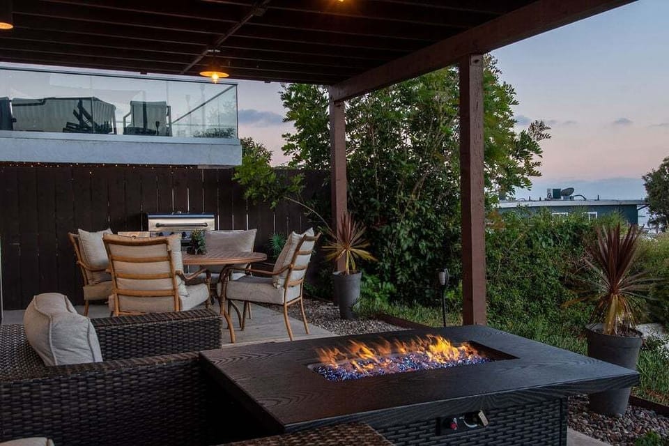 Unwind by the cozy fire pit – perfect for outdoor dining and late-night conversations.