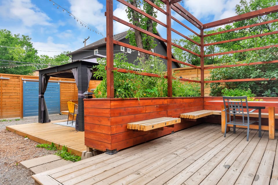 Outdoor seating area with herb and flower garden