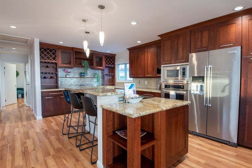 Gather around the sleek bar seating in the modern kitchen.