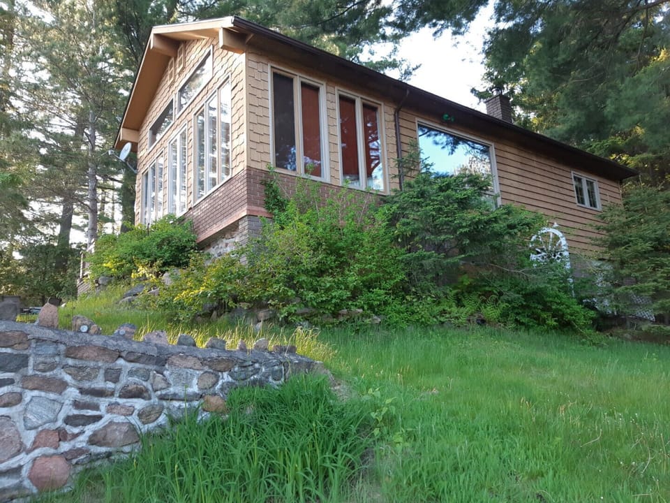 Exterior of cottage which faces lake.