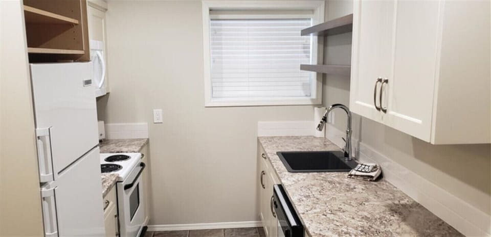 Basement Suite Kitchen with Microwave and Dishwasher.