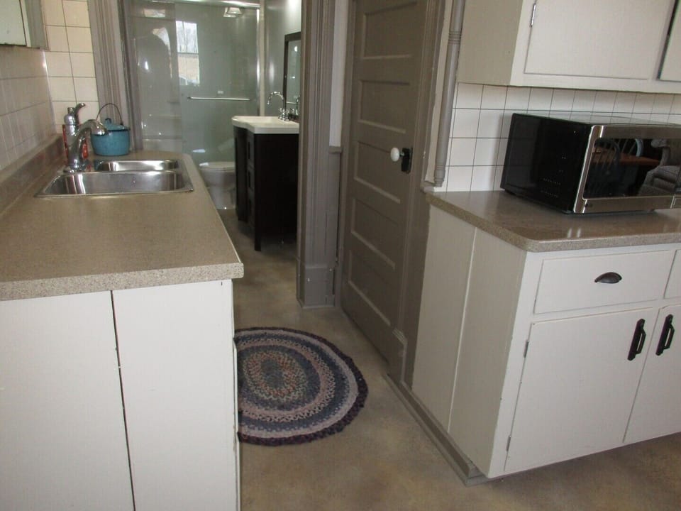 Full bathroom on the main level includes a shower.